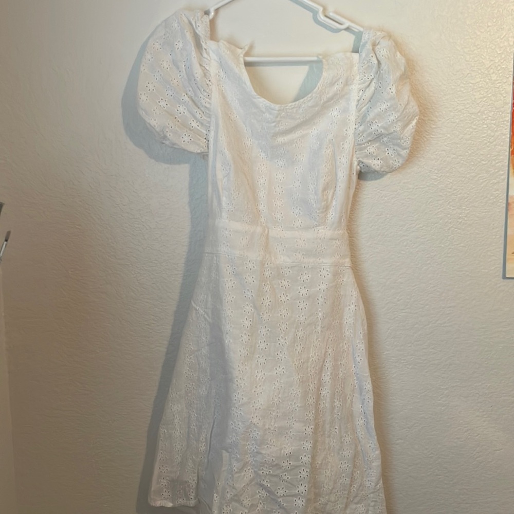 White lace dress with open back and tie details